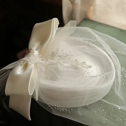 White Bridal Headpiece with Mesh Veil - Image 2